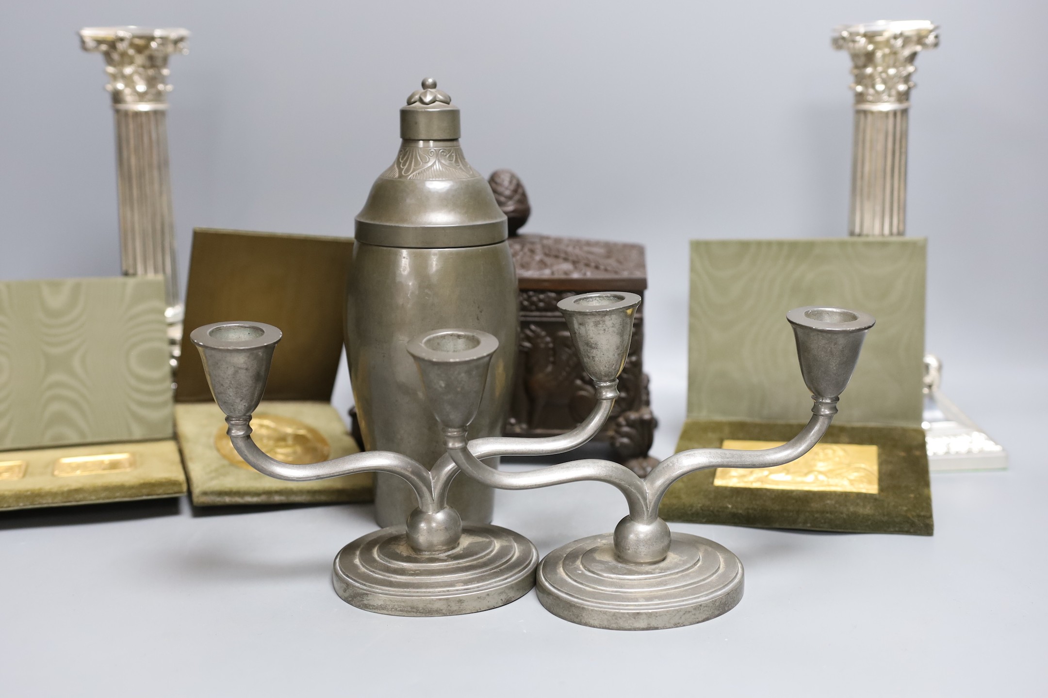 A German Babcock Werke cigarette box, together with mixed pewter, a pair of plated candlesticks and three religious relief plaques